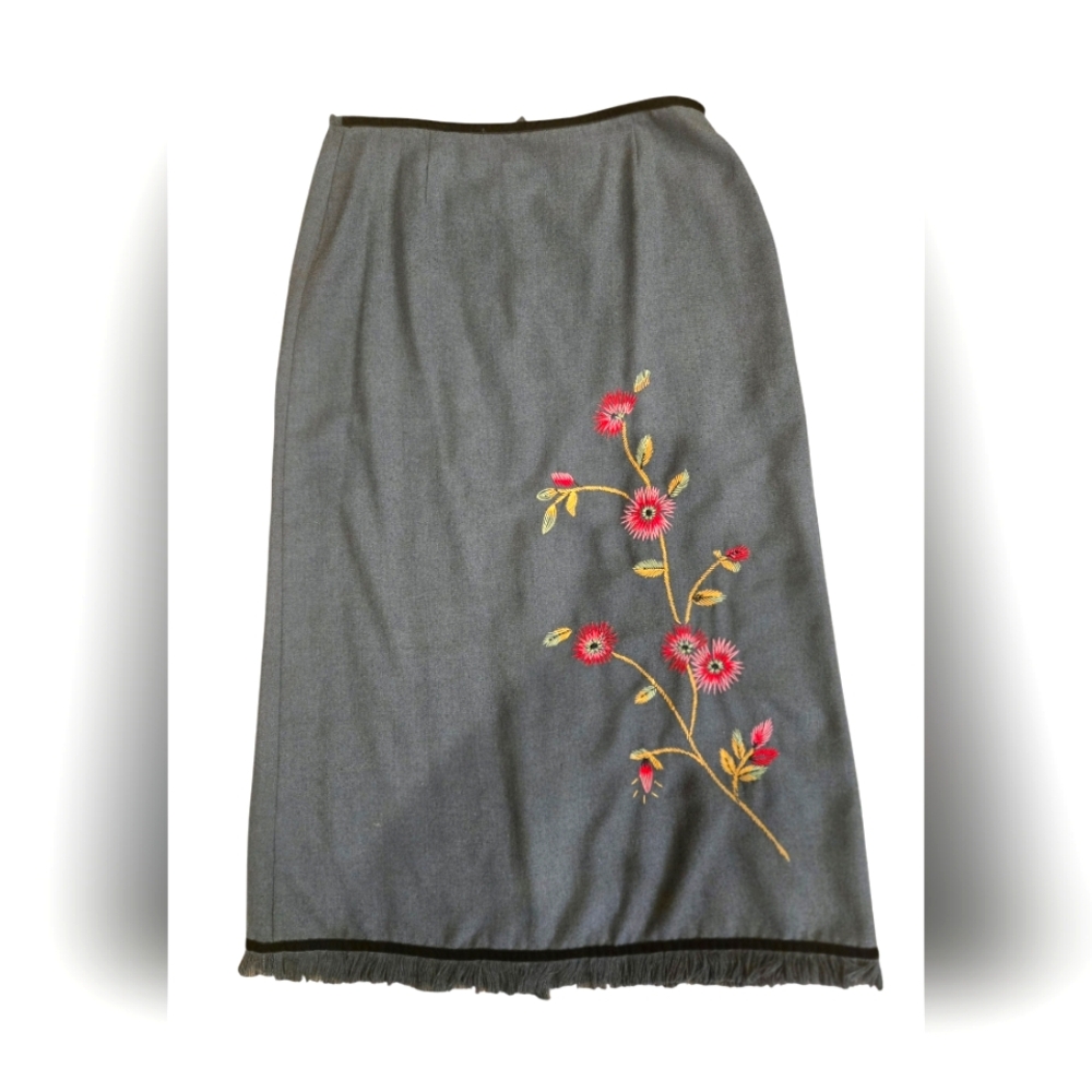 Long skirt with embroidered flowers and fringe at the bottom.  Women's 10. zips